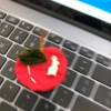 The leaves of the Korean-style linen apple are hand-hooked with wool thread details Picture